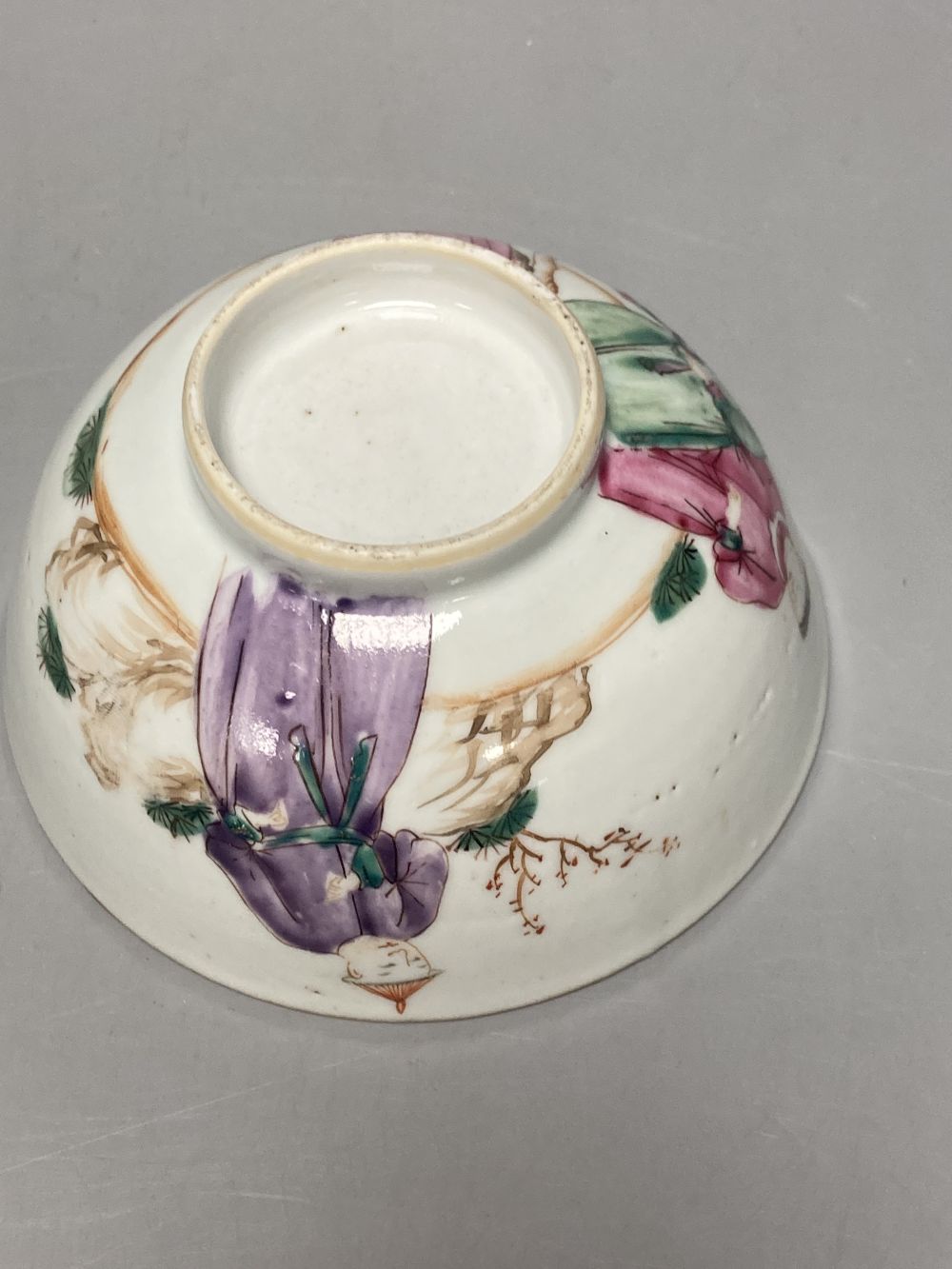 An 18th century Chinese famille rose bowl, 11.5cm diameter, and three smaller Chinese porcelain bowls